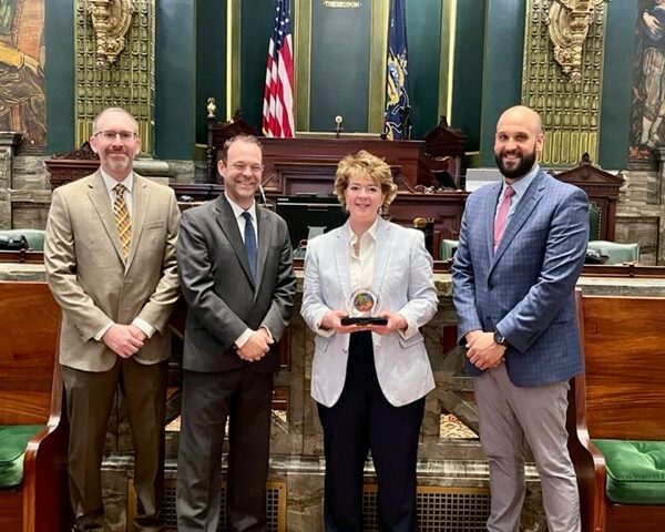 Andrew Christ, John Callahan and Jonathan Berger present Senator Brooks with Champion of Public Education award